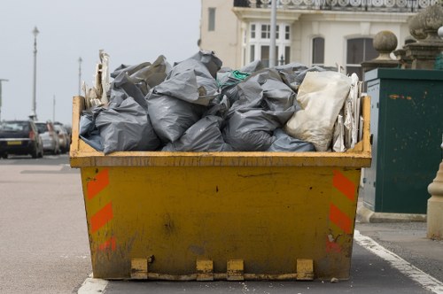 Business professionals discussing waste removal strategies in an office